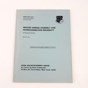 May include: A light blue technical report titled Printed Wiring Assembly and Interconnection Reliability, dated November 1981. The cover features the Rome Air Development Center emblem, author David W. Coit, and a box stating Approved for Public Release.