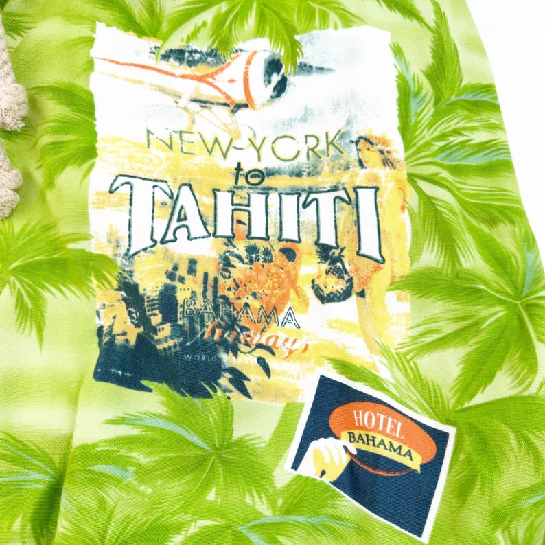May include: A light green fabric with a tropical print featuring palm trees and a vintage travel graphic. The graphic reads "New York to Tahiti" with images of an airplane and a woman. A "Hotel Bahama" patch is also visible.