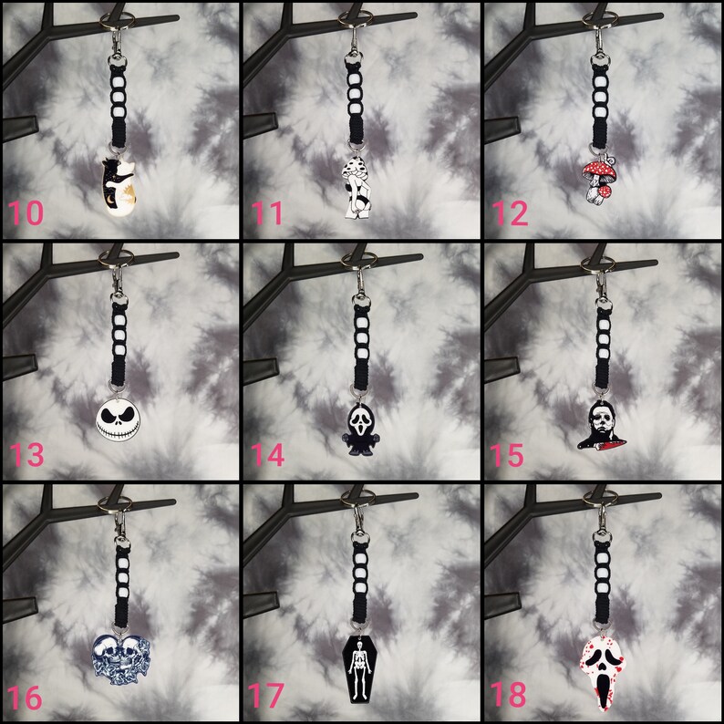 May include: A set of 9 Halloween-themed keychains featuring various characters and designs. The keychains are black and white with a black cord and a silver key ring. The characters include a cat, a ghost, a mushroom, Jack Skellington, a ghost with a knife, Michael Myers, a skull, a skeleton, and Ghostface.