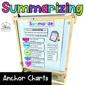 May include: Wooden easel with a white board featuring the word "Summarizing" in colorful letters. The board includes text and diagrams about summarizing stories, with the words "Summarize" and "Anchor Charts" also visible.