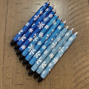 Plumas epoxi de copo de nieve de invierno azul