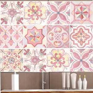May include: Twelve pink and white patterned tile stickers with intricate floral designs. The stickers are arranged in a 3x4 grid and are displayed on a bathroom counter with a sink and toiletries.