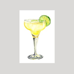 May include: A yellow margarita cocktail in a clear glass with a lime wedge garnish. The drink is served in a stemmed glass with a wide rim.