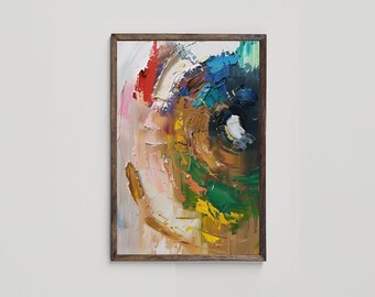 May include: Abstract painting with a circular design in shades of brown, green, blue, yellow, red, and white. The painting is framed in a wooden frame.
