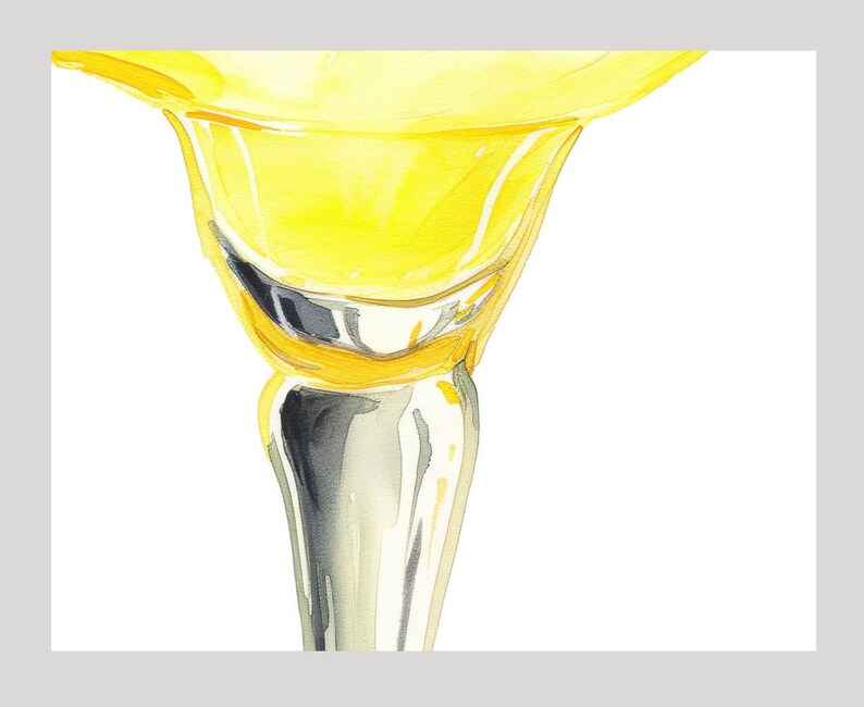 May include: A close-up of a yellow glass goblet with a silver stem. The goblet is filled with a yellow liquid.
