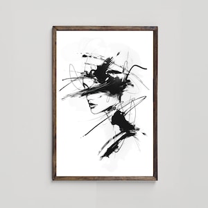 May include: Black and white abstract art print of a woman's face with bold brushstrokes and lines. The print is framed in a brown wood frame.