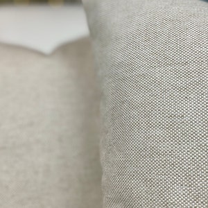 Close up. Cotton linen basket weave blend. Pillow covers with invisible zipper closure. Natural beige colour. Minimalist, modern, rustic , contemporary decor.