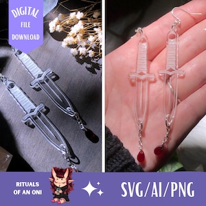 May include: A pair of clear acrylic earrings shaped like daggers with red teardrop charms hanging from the bottom. The earrings are displayed on a hand and on a table with flowers. The text "DIGITAL FILE DOWNLOAD" and "RITUALS OF AN ONI" are visible in the image. The text "SVG/AI/PNG" is also visible in the image.