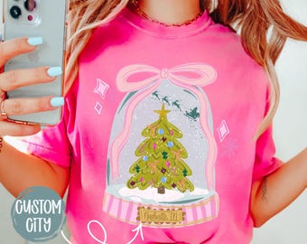 Personalized Snow Globe Hometown Christmas Shirt, Comfort Colors® Custom Christmas Small Town Tee, Preppy Bow Christmas Shirt for Women