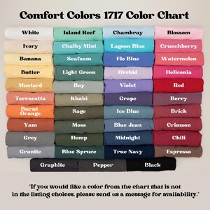 May include: A color chart titled "Comfort Colors 1717 Color Chart" displays a variety of fabric colors. Colors include White, Island Reef, Chambray, Blossom, and many more. The text at the bottom says, "If you would like a color from the chart that is not in the listing choices, please send us a message for availability."