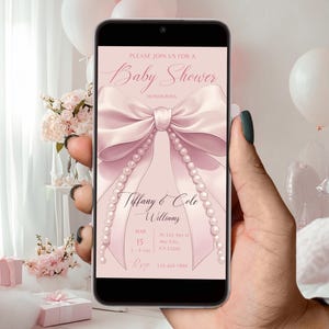 May include: A pink and white baby shower invitation with a large pink bow and pearl accents. The invitation reads "Please join us for a Baby Shower honoring Tiffany & Cole Williams".