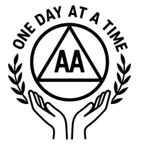 May include: Black and white graphic of the AA symbol inside a circle, with the words "ONE DAY AT A TIME" around the edge. Two hands cradle the symbol, flanked by laurel branches.