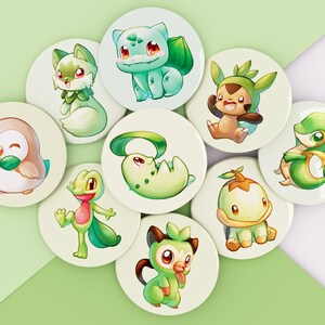 Peut inclure: Neuf boutons ronds blancs avec des personnages de dessins animés verts et blancs. Les personnages sont inspirés de personnages de jeux vidéo populaires.