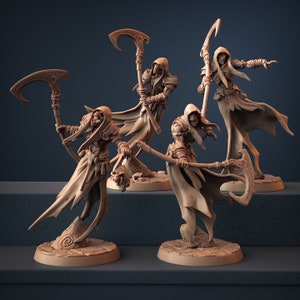 May include: Four beige-colored miniature figurines of Grim Reapers, each holding a scythe. The figures are detailed with skeletal faces, hooded cloaks, and ornate bases. The background is a dark blue.