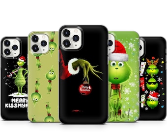 May include: Four different iPhone cases featuring the Grinch from the movie How the Grinch Stole Christmas. The cases are black with green, red, and white designs. The text on one case reads "Merry Kissmya". Another case reads "Let it snow!"