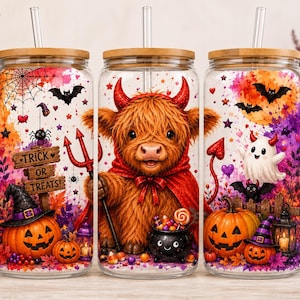 May include: Three clear glass tumblers with bamboo lids and glass straws, featuring a colorful Halloween design with a fluffy highland cow dressed as a devil, pumpkins, a ghost, a spider web, and a wooden sign reading Trick or Treats.