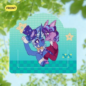 May include: A rectangular acrylic standee featuring a blue unicorn character in a top hat and a purple unicorn character. The background is a teal gradient with a halftone dot pattern, yellow star outlines, and a checkered base. The text FRONT is visible.
