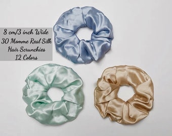 May include: Three silk scrunchies in light blue, light green, and beige. 8 cm/3 inch wide. 30 Momme Real Silk Hair Scrunchies. 12 Colors.