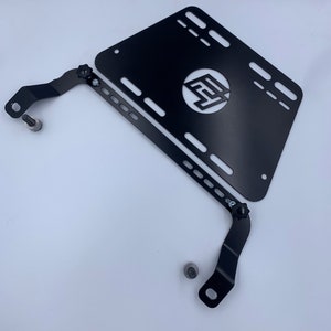 Toyota GT86 fire extinguisher holder bracket mounted on OEM seat rails. Ensure safety with easy access to the fire extinguisher while driving. A reliable addition to your GT86 for emergency situations