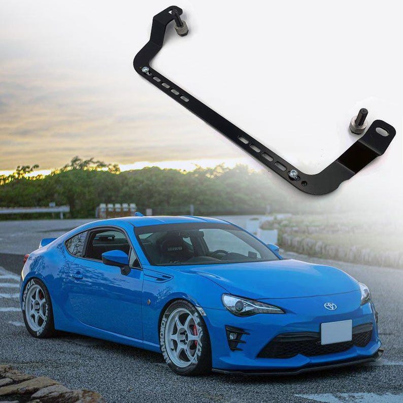 Fire extinguisher holder bracket for cars, shown above Subaru BRZ for automotive interior mounting.