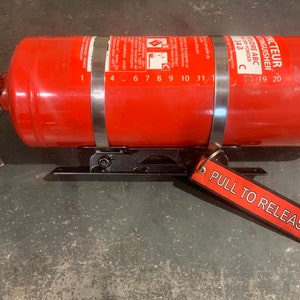 Quick release fire extinguisher bracket