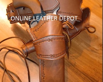 Puede incluir: Una funda de pistola de cuero marrón con un diseño cosido. La funda está unida a un cinturón de cuero marrón con un diseño cosido. El texto "ONLINE LEATHER DEPOT" es visible en el cinturón.