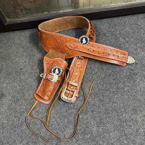 ウエスタンレザーカートリッジベルト、弾薬ループとハンマーストラップ付き、リボルバーホルスター、ガンカバー付き。.22、.32、.357、.38、.44、.45