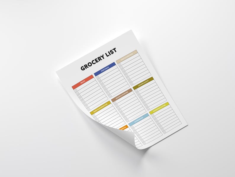 May include: A white grocery list notepad with the title "GROCERY LIST" in black. The notepad has sections for fruits, vegetables, and other food categories, each with a different colored header. The notepad is on a white surface.