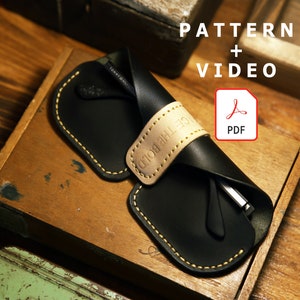 Peut inclure: Un étui à lunettes en cuir noir avec une sangle en cuir beige et des coutures jaunes. L'étui est fermé et contient une paire de lunettes. Le texte "PATTERN + VIDEO" est écrit au-dessus d'une icône PDF rouge avec le mot "PDF" en dessous.