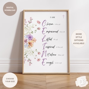 May include: A framed print with the words "I AM CHOSEN, EMPOWERED, LIFTED, INSPIRED, NOT ALONE, ENOUGH" in purple script. Floral watercolor art in pastel colors adorns the left side. The print is in a light wood frame.
