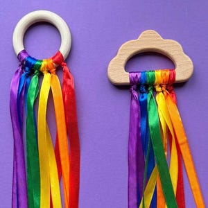 Wooden ring with colorful ribbons as a grasping ring or sensory toy