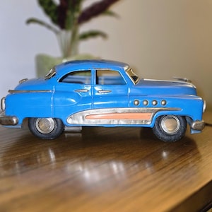 VINTAGE 1950s Blue Buick Tin Friction Toy Car With Peach Detail
