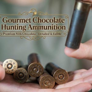 May include: Gourmet Chocolate Hunting Ammunition, Premium Milk Chocolate - Detailed & Edible. Several cylindrical milk chocolate pieces shaped like shotgun shells, featuring metallic-coloured bases stamped with the number 12 and star icons.