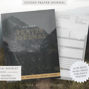 May include: A guided prayer journal with a mountain landscape cover. The journal includes space for daily prayers, notes, and reflections. The cover text reads "Guided Prayer Journal" in gold lettering. The journal is a physical booklet.