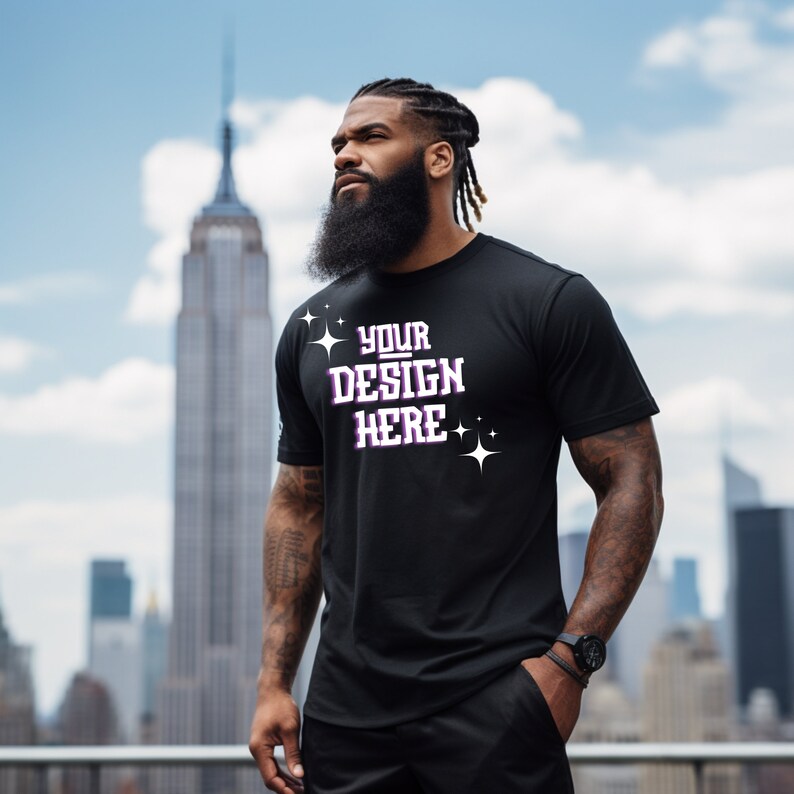 May include: A black t-shirt with the text "YOUR DESIGN HERE" in white with purple accents and small stars.