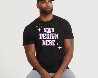 May include: A black t-shirt with a white graphic that says "YOUR DESIGN HERE" with purple accents and white stars.