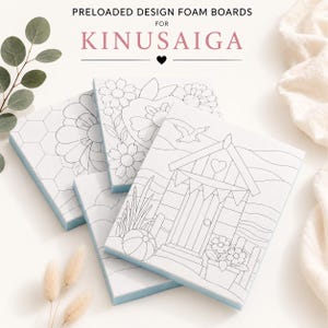 May include: Three white foam boards for Kinusaiga featuring black line art designs. One board shows a beach hut with a seagull, another displays floral patterns, and the third depicts a honeycomb motif. The text reads PRELOADED DESIGN FOAM BOARDS FOR KINUSAIGA.