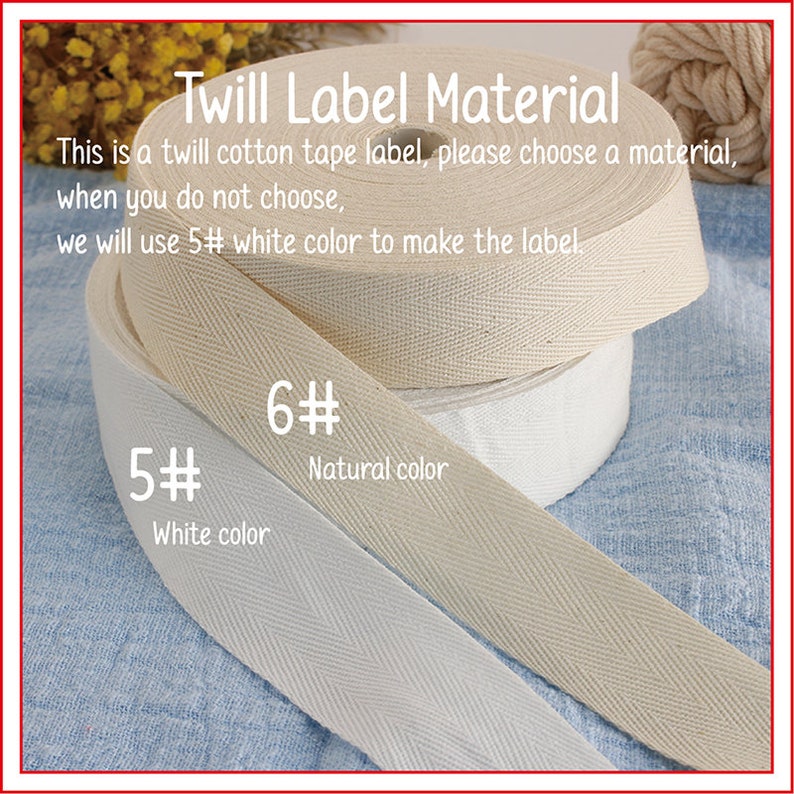 K&ouml;nnte beinhalten: Zwei Rollen Twill-Baumwollband f&uuml;r Etiketten. Die obere Rolle ist naturfarben und mit "6#" beschriftet, die untere Rolle ist wei&szlig; und mit "5# Wei&szlig;e Farbe" beschriftet.