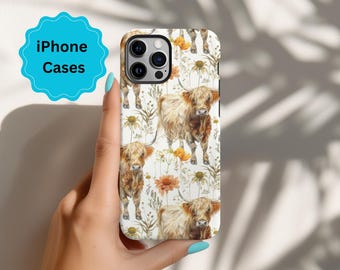 May include: A white iPhone case with a pattern of brown and white Highland cows and yellow flowers.