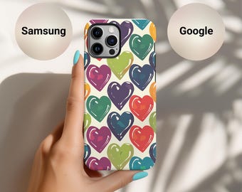 May include: A white phone case with a colorful heart pattern. The case has a camera cutout and a white background.