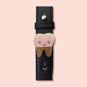 Pin it to your bag straps.