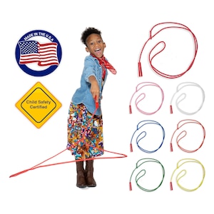 May include: A child holds a red skipping rope with a handle. The skipping rope is made of a flexible, durable material. The image also shows six additional skipping ropes in different colours: red, pink, white, blue, yellow, and green.  The skipping ropes are all made of the same material and have the same handle design.  Made in the USA. Child Safety Certified.