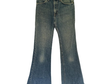 Jeans Levi's 681 acampanados vintage de los años 80, fabricados en EE. UU., con etiqueta naranja.