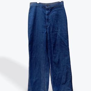May include: A pair of dark blue denim jeans with a high waist and a straight leg.