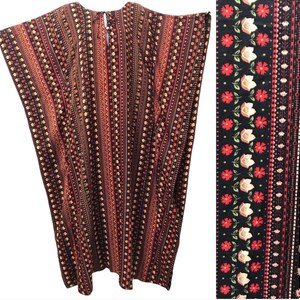 May include: A long, flowing caftan in a bohemian style. The fabric features vertical stripes in shades of black, red, and cream, with floral and geometric patterns. The caftan has a round neckline and a loose, comfortable fit.