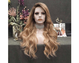 May include: A long, wavy, light blonde wig with a subtle ombre effect. The wig is styled in loose waves and falls to the shoulders.