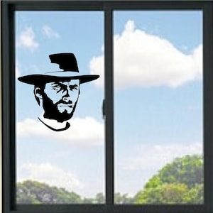 Puede incluir: Silueta en blanco y negro de un hombre con sombrero, diseñada como calcomanía para ventana. La imagen muestra un retrato de un hombre con barba y expresión seria, sobre un cielo azul nublado.