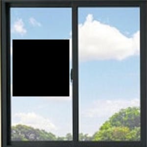 May include: A black-framed sliding window with two glass panes. The left pane features a solid black square covering the centre, while the right pane shows a clear view of a blue sky with white clouds and green trees visible at the bottom.