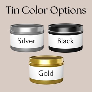 May include: Three round metal tins with labels. The tins are silver, black, and gold. The labels have the words "Silver", "Black", and "Gold" printed on them.