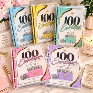 May include: Five ring-bound budgeting planners with clear covers, each featuring the text 100 Envelopes, Small Steps Big Results, and Cash Budgeting. The planners come in blue, yellow, teal, pink, and purple, each displaying a graphic of cash.